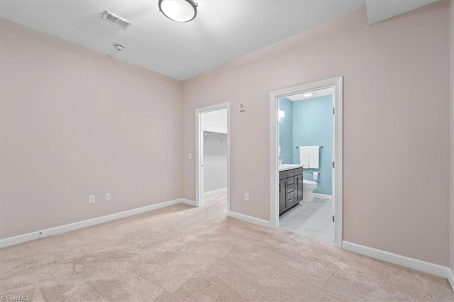 spare room with light colored carpet