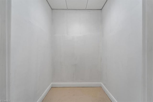 unfurnished room with a drop ceiling