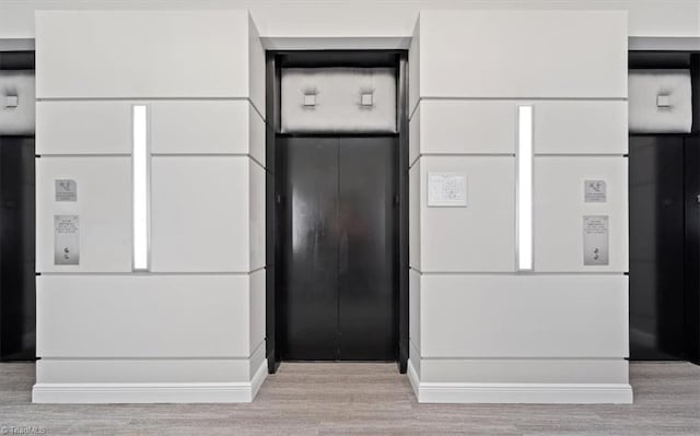 interior details featuring wood-type flooring