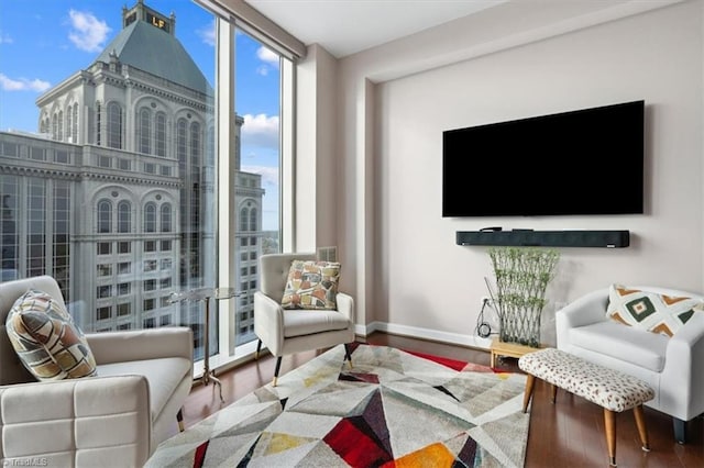 interior space featuring hardwood / wood-style floors and a wall of windows