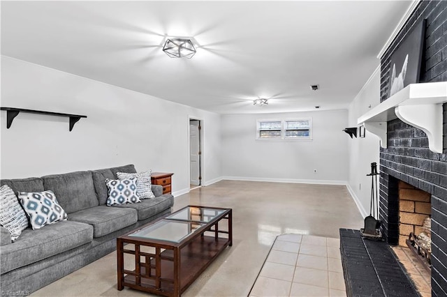 living room featuring baseboards, concrete floors, and a fireplace