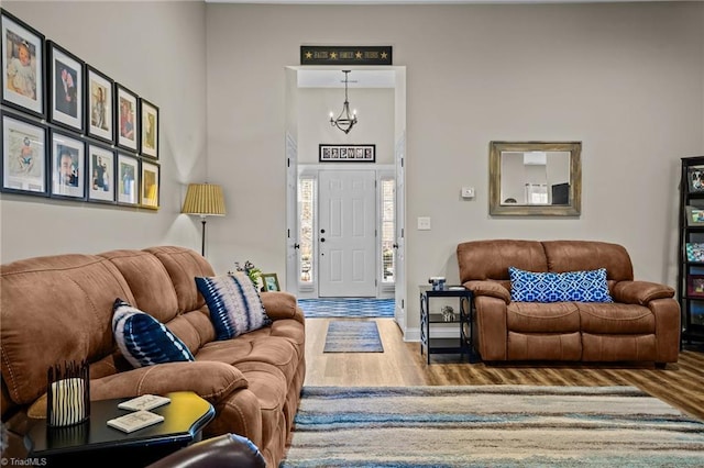 living room featuring hardwood / wood-style floors and a notable chandelier