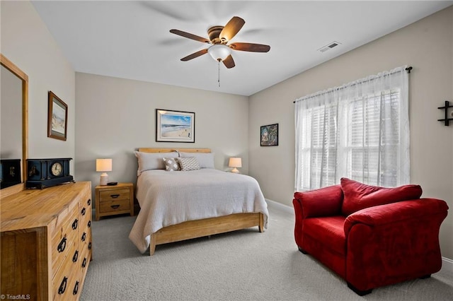 bedroom with ceiling fan and carpet flooring