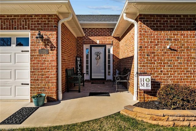 view of exterior entry featuring a garage