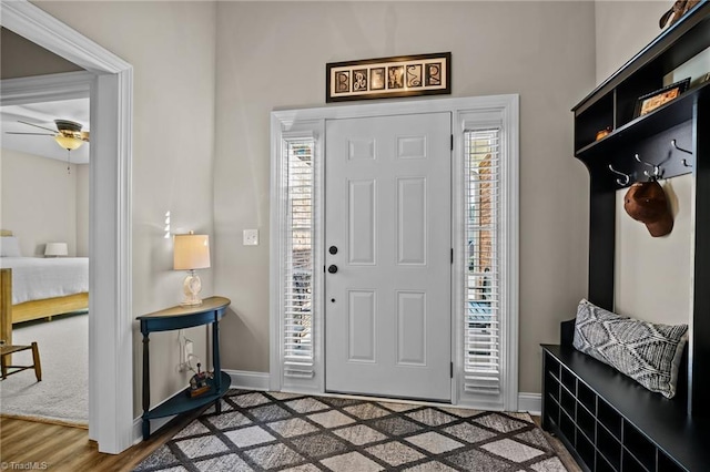 entrance foyer with ceiling fan and hardwood / wood-style floors