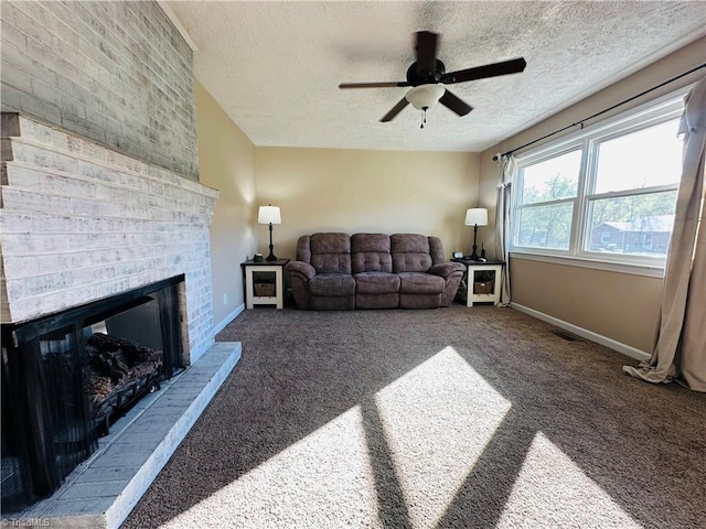 living room with carpet, a textured ceiling, baseboards, and ceiling fan