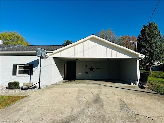 garage featuring concrete driveway