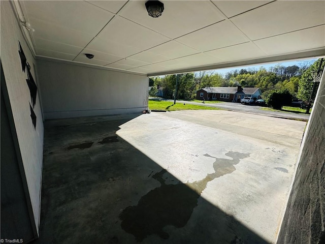 view of patio / terrace featuring a carport and driveway