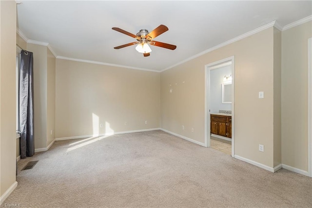 unfurnished room with baseboards, light carpet, ornamental molding, and a ceiling fan