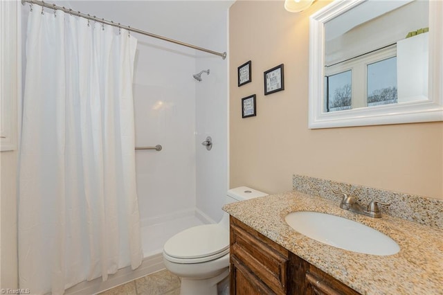 bathroom with vanity, a shower with shower curtain, and toilet