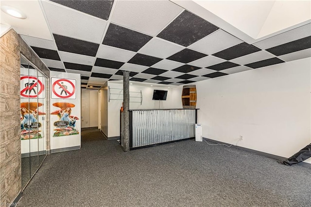 interior space featuring a paneled ceiling