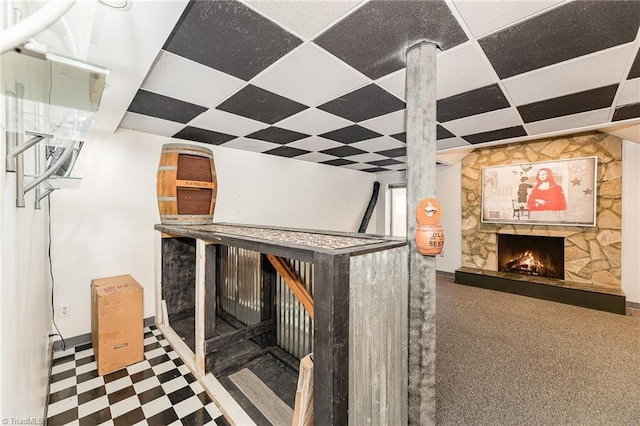 room details featuring a paneled ceiling and a fireplace