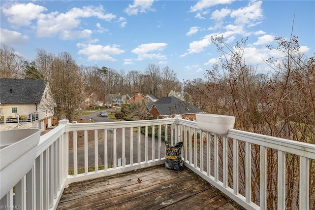 wooden deck with a residential view