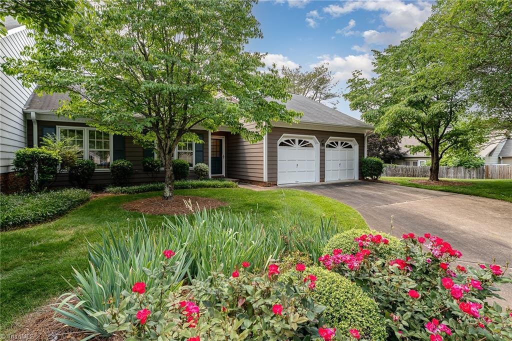 1305 Glen Raven Ct, Greensboro, NC 27410 - view of front of home featuring a garage and driveway
