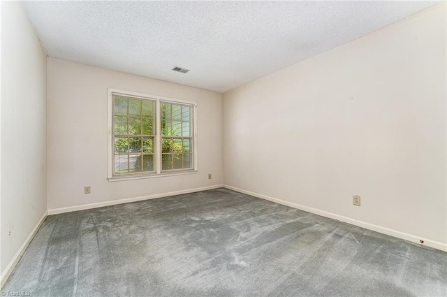 1305 Glen Raven Ct, Greensboro, NC 27410 - carpeted spare room with baseboards and a textured ceiling