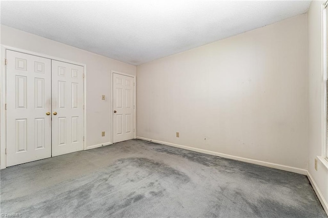 1305 Glen Raven Ct, Greensboro, NC 27410 - unfurnished bedroom featuring carpet floors, baseboards, and a closet