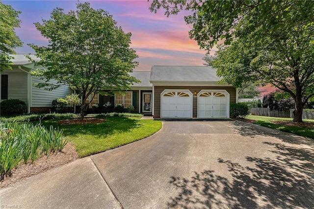 1305 Glen Raven Ct, Greensboro, NC 27410 - view of front of house featuring an attached garage and asphalt driveway