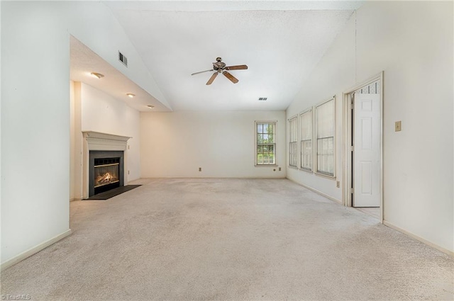 1305 Glen Raven Ct, Greensboro, NC 27410 - unfurnished living room with lofted ceiling, carpet floors, a ceiling fan, a fireplace with flush hearth, and baseboards