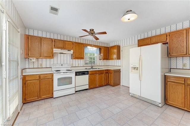 1305 Glen Raven Ct, Greensboro, NC 27410 - kitchen with white appliances, under cabinet range hood, wallpapered walls, a sink, and ceiling fan