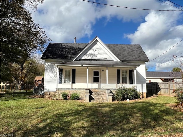 view of front of home featuring covered porch and a front lawn