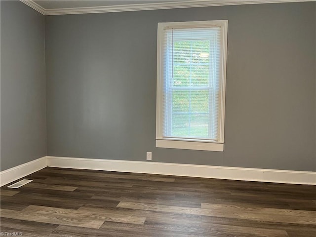 unfurnished room with crown molding and dark hardwood / wood-style floors