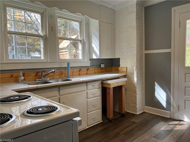 kitchen featuring white cabinets, dark hardwood / wood-style flooring, crown molding, white range with electric stovetop, and sink