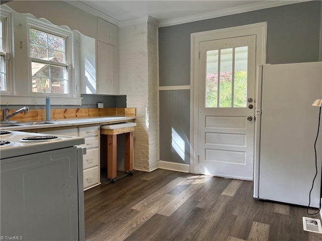kitchen featuring white appliances, ornamental molding, dark wood-style flooring, light countertops, and white cabinets
