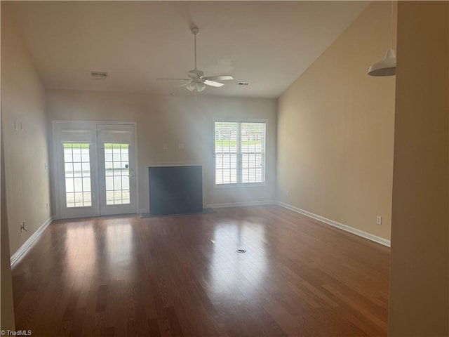 401 Pelican Ln, Clemmons, NC 27012 - unfurnished living room featuring visible vents, plenty of natural light, a ceiling fan, and wood finished floors