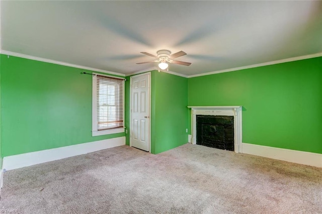 unfurnished living room featuring crown molding, ceiling fan, and light colored carpet