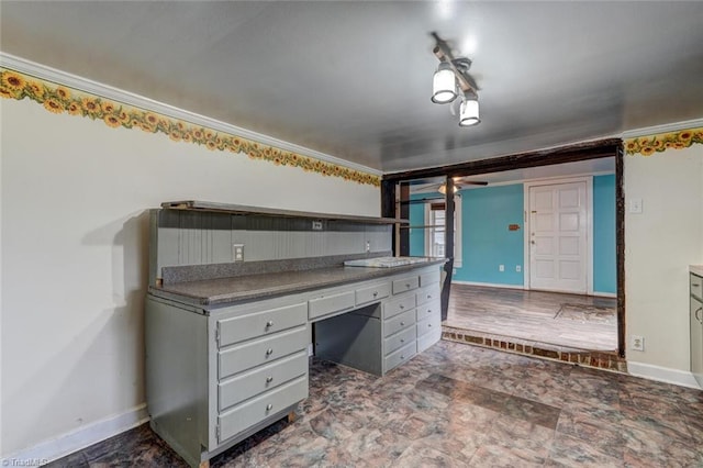 kitchen featuring ornamental molding and gray cabinetry