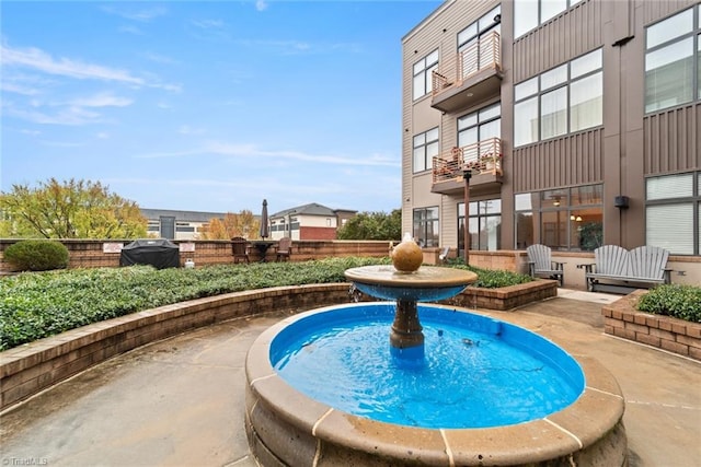 view of pool featuring area for grilling