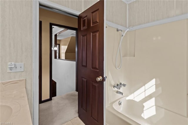 bathroom featuring tile patterned flooring, vanity, and shower / bathtub combination