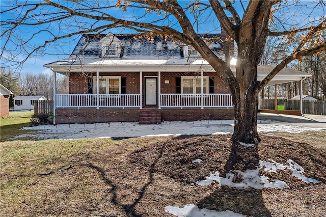 view of front of property with a carport and covered porch