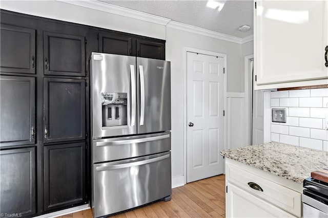 kitchen with crown molding, a textured ceiling, light stone countertops, light wood-type flooring, and stainless steel fridge with ice dispenser