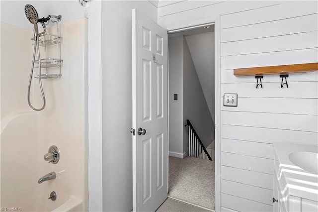 bathroom featuring tub / shower combination and vanity