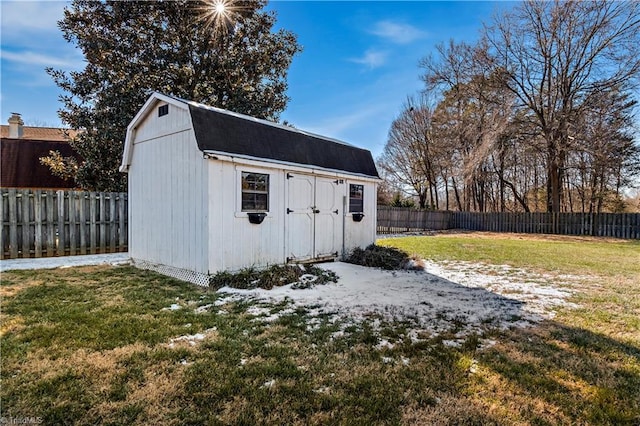 view of shed with a fenced backyard