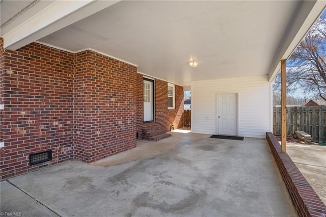 view of patio with entry steps and fence