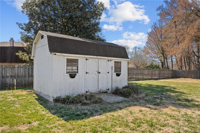 view of shed featuring a fenced backyard