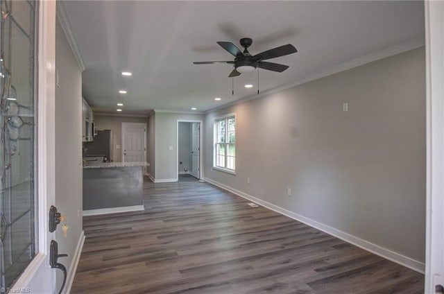 714 Martin St, Greensboro, NC 27406 - unfurnished living room with baseboards, ornamental molding, and recessed lighting