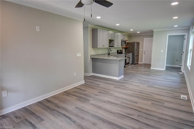 714 Martin St, Greensboro, NC 27406 - kitchen featuring crown molding, gray cabinets, stainless steel appliances, a ceiling fan, and recessed lighting