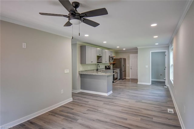714 Martin St, Greensboro, NC 27406 - kitchen featuring a ceiling fan, appliances with stainless steel finishes, baseboards, ornamental molding, and recessed lighting