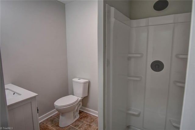 714 Martin St, Greensboro, NC 27406 - bathroom with baseboards, a shower, toilet, and vanity