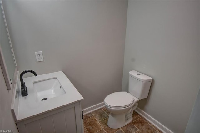 714 Martin St, Greensboro, NC 27406 - bathroom with toilet, baseboards, and vanity