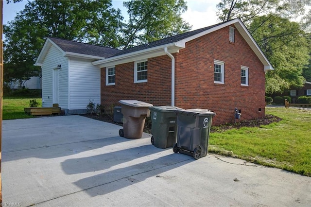 714 Martin St, Greensboro, NC 27406 - back of property with a yard, brick siding, and a patio area