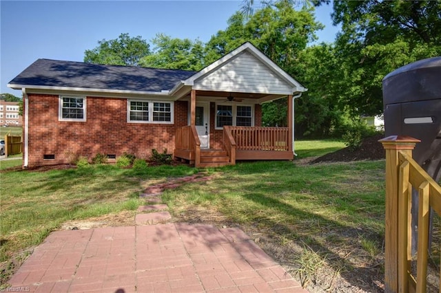 714 Martin St, Greensboro, NC 27406 - rear view of property with covered porch, brick siding, a ceiling fan, crawl space, and a yard