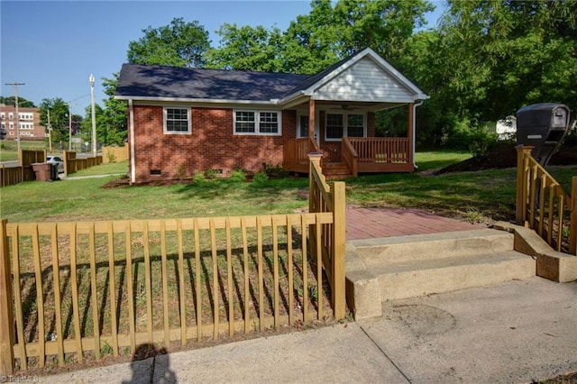 714 Martin St, Greensboro, NC 27406 - ranch-style house featuring covered porch, a front yard, brick siding, and crawl space