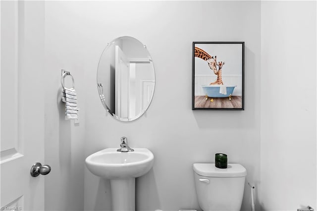 half bathroom with toilet