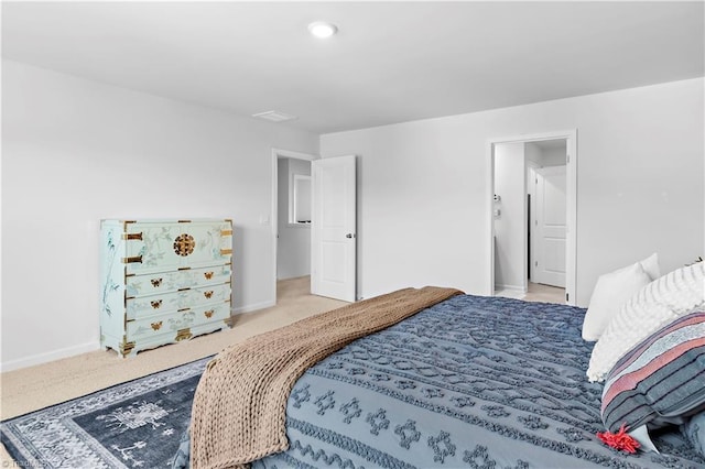 bedroom with carpet floors and baseboards