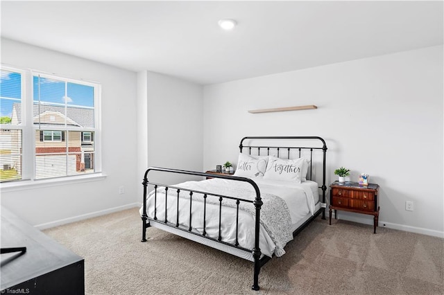 carpeted bedroom with baseboards