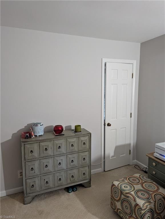 bedroom with light colored carpet